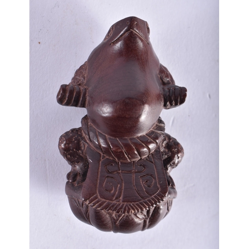 2220 - A JAPANESE CARVED WOOD FROG NETSUKE. 16.9 grams. 6 cm x 4 cm.