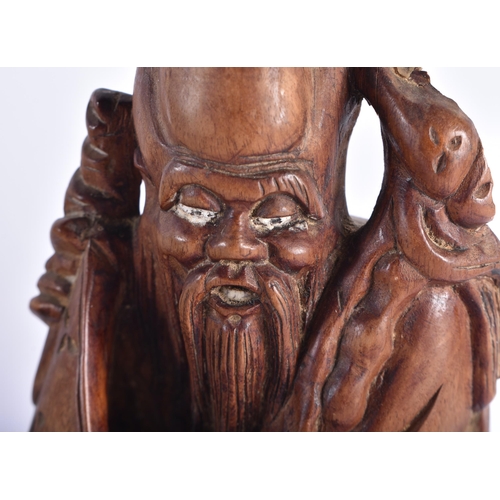 2225 - AN 18TH CENTURY CHINESE CARVED WOOD FIGURE OF A SCHOLAR Qing, together with another hardwood figure.... 