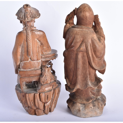 2225 - AN 18TH CENTURY CHINESE CARVED WOOD FIGURE OF A SCHOLAR Qing, together with another hardwood figure.... 