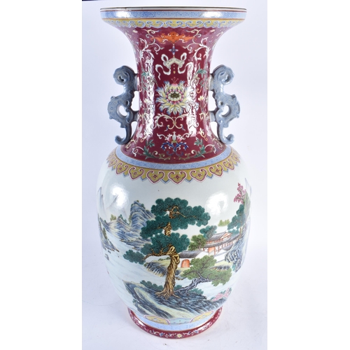 2241 - A VERY LARGE CHINESE RUBY GROUND FAMILLE ROSE TWIN HANDLED PORCELAIN VASE 20th Century. 71 cm high.