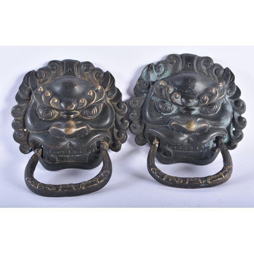 2334 - A PAIR OF CHINESE TIBETAN BRONZE MASK DOOR KNOCKERS 20th Century. 20 cm x 15 cm.