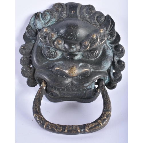 2334 - A PAIR OF CHINESE TIBETAN BRONZE MASK DOOR KNOCKERS 20th Century. 20 cm x 15 cm.