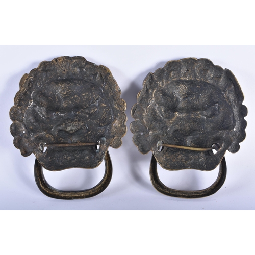 2334 - A PAIR OF CHINESE TIBETAN BRONZE MASK DOOR KNOCKERS 20th Century. 20 cm x 15 cm.