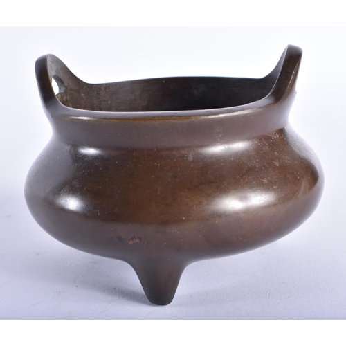 2440 - A CHINESE TWIN HANDLED BRONZE CENSER 20th Century. 10.5 cm wide, internal width 9 cm.