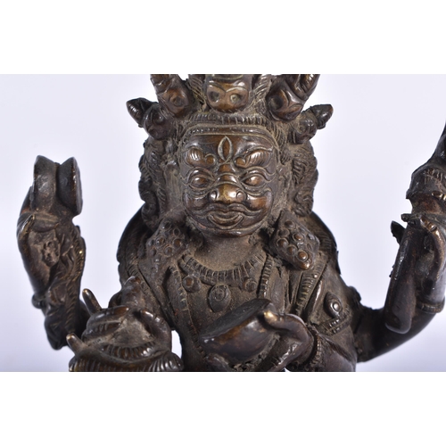 2456 - A 19TH CENTURY TIBETAN BRONZE FIGURE OF A BUDDHA modelled upon a lotus form base. 13 cm x 9 cm.