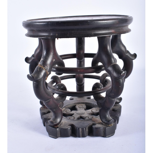 2572 - A 19TH CENTURY CHINESE CARVED HARDWOOD CIRCULAR DISPLAY STAND Qing, with open work body. 18 cm wide,... 