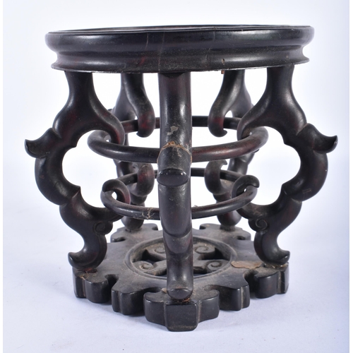 2572 - A 19TH CENTURY CHINESE CARVED HARDWOOD CIRCULAR DISPLAY STAND Qing, with open work body. 18 cm wide,... 