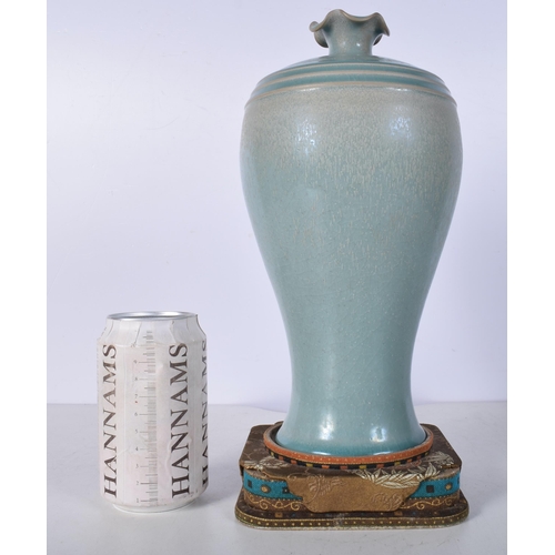 3042 - A Chinese porcelain Ru Ware vase with stand 27cm.