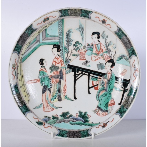 3049 - A Chinese porcelain Qing Dynasty Famille Verte dish decorated with figures 5 x 29 cm.