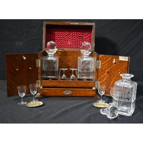 3434 - An Antique oak cased Tantalus  set with three cut glass Decanters and 6 associated glasses 31 x 31 x... 