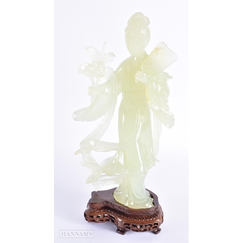 101 - TWO EARLY 20TH CENTURY CHINESE CARVED JADE FIGURES OF IMMORTALS Late Qing. Largest 30 cm high. (2)