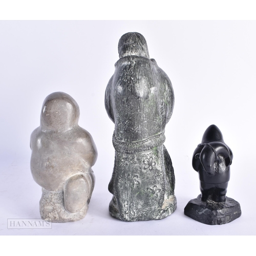 107 - THREE NORTH AMERICAN INUIT TRIBAL FIGURES. Largest 23.5 cm high. (3)