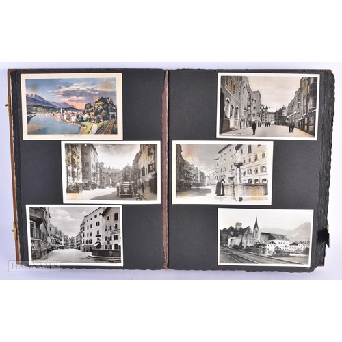 126 - AN UNUSUAL EARLY 20TH CENTURY SWISS BAVARIAN BLACK FOREST POSTCARD ALBUM formed in relief with a mou... 