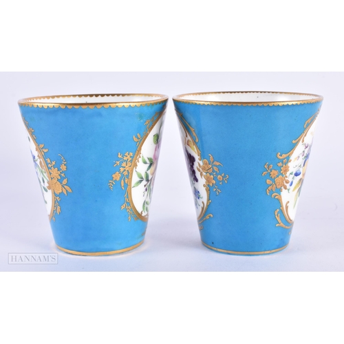 128 - A PAIR OF EARLY 19TH CENTURY CONTINENTAL SEVRES COALPORT PORCELAIN BEAKERS painted with flowers unde... 