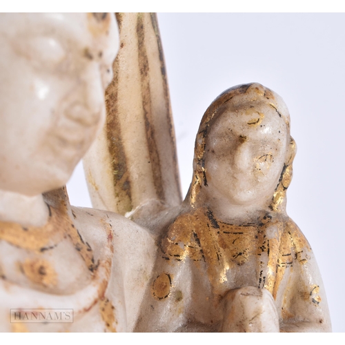 130 - AN 18TH/19TH CENTURY INDIAN RAJASTHAN LACQUERED MARBLE FIGURE OF A DEITY modelled with an attendant.... 