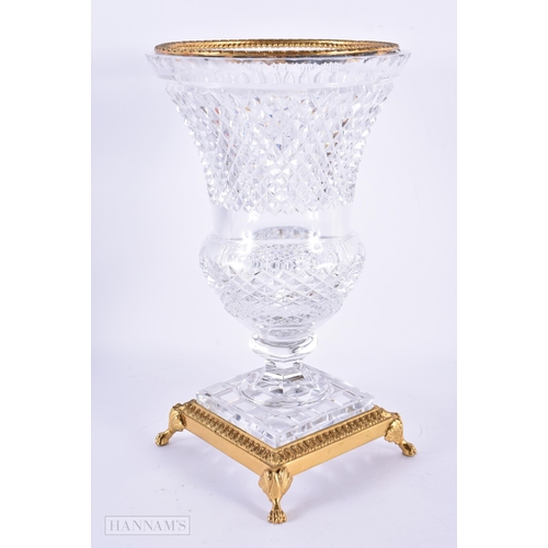 132 - AN EARLY 20TH CENTURY FRENCH CUT GLASS GILT METAL VASE possibly Baccarat. 26 cm x 14 cm.