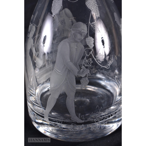 135 - AN UNUSUAL EARLY 20TH CENTURY EUROPEAN GLASS DECANTER AND STOPPER depicting grape pickers, dated, 21... 