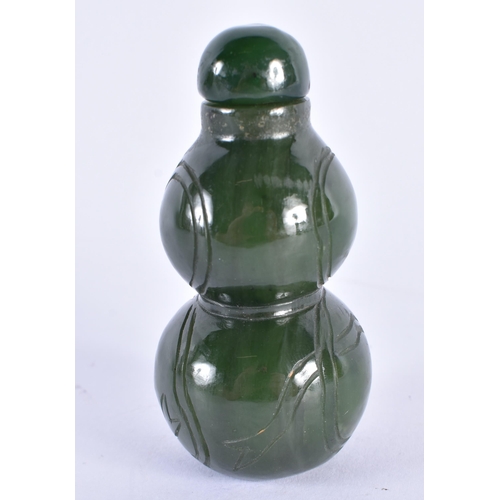 149 - A LATE 19TH CENTURY CHINESE CARVED SPINACH JADE SNUFF BOTTLE AND STOPPER Late Qing. 7.25 cm high.