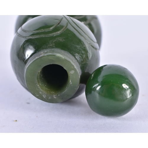 149 - A LATE 19TH CENTURY CHINESE CARVED SPINACH JADE SNUFF BOTTLE AND STOPPER Late Qing. 7.25 cm high.