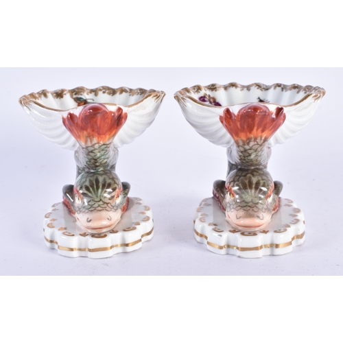 157 - AN UNUSUAL PAIR OF 19TH CENTURY GERMAN KPM BERLIN PORCELAIN SALTS painted with exotic birds. 7 cm x ... 