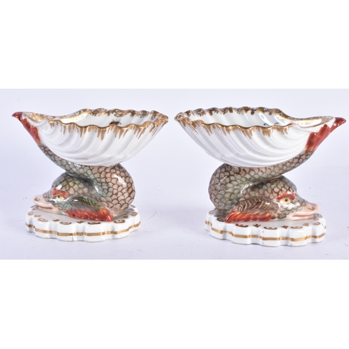 157 - AN UNUSUAL PAIR OF 19TH CENTURY GERMAN KPM BERLIN PORCELAIN SALTS painted with exotic birds. 7 cm x ... 