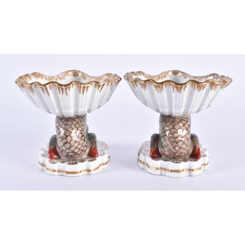 157 - AN UNUSUAL PAIR OF 19TH CENTURY GERMAN KPM BERLIN PORCELAIN SALTS painted with exotic birds. 7 cm x ... 