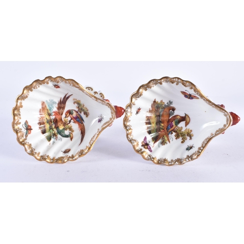 157 - AN UNUSUAL PAIR OF 19TH CENTURY GERMAN KPM BERLIN PORCELAIN SALTS painted with exotic birds. 7 cm x ... 