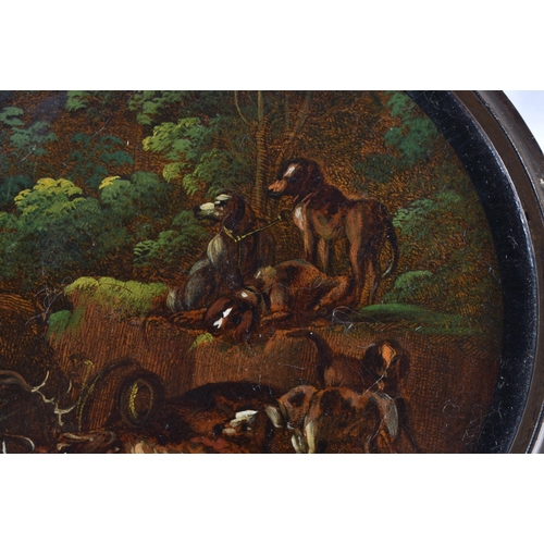 178 - AN EARLY 19TH CENTURY PAPIER MACHE SNUFF BOX AND COVER painted with hounds in a landscape. 9.5 cm di... 