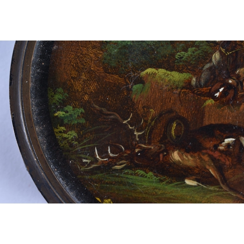 178 - AN EARLY 19TH CENTURY PAPIER MACHE SNUFF BOX AND COVER painted with hounds in a landscape. 9.5 cm di... 