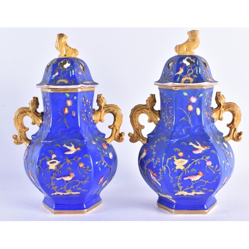 187 - AN UNUSUAL PAIR OF MID 19TH CENTURY ENGLISH VASES AND COVERS decorated in relief with birds and foli... 