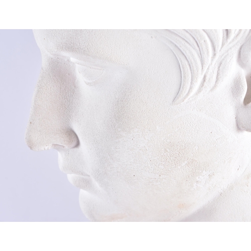 193 - A LARGE COUNTRY HOUSE PLASTER BUST OF JULIUS CAESAR upon a marble plinth. 55 cm x 25 cm.