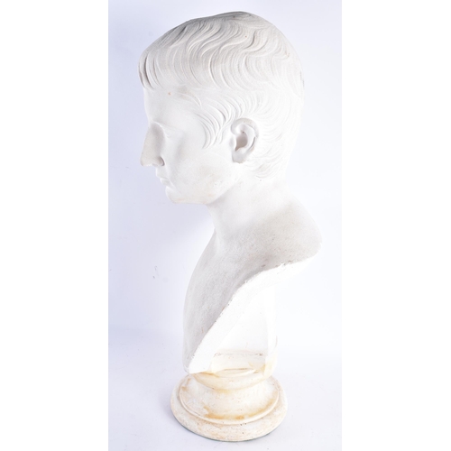 193 - A LARGE COUNTRY HOUSE PLASTER BUST OF JULIUS CAESAR upon a marble plinth. 55 cm x 25 cm.