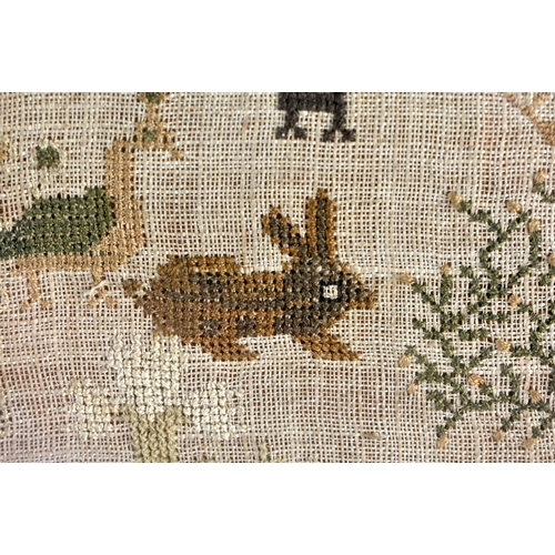 195 - A FRAMED ANTIQUE EMBROIDERED SAMPLER decorated with rabbits , birds and a house. 48 cm x 30 cm.