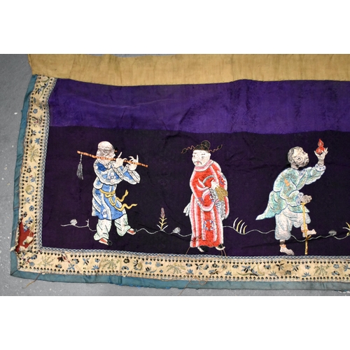 199 - A LARGE 19TH CENTURY CHINESE SILK EMBROIDERED PURPLE PANEL Qing, decorated with immortals. 155 cm x ... 