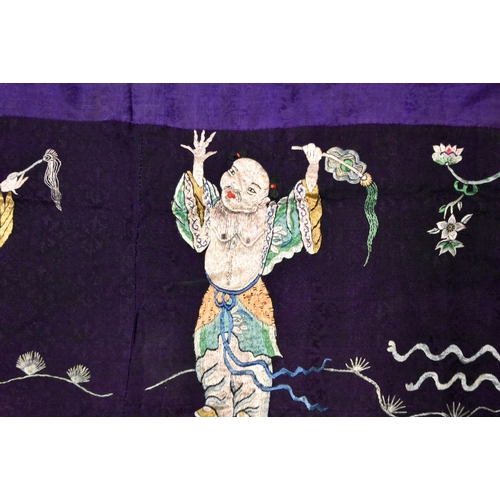 199 - A LARGE 19TH CENTURY CHINESE SILK EMBROIDERED PURPLE PANEL Qing, decorated with immortals. 155 cm x ... 