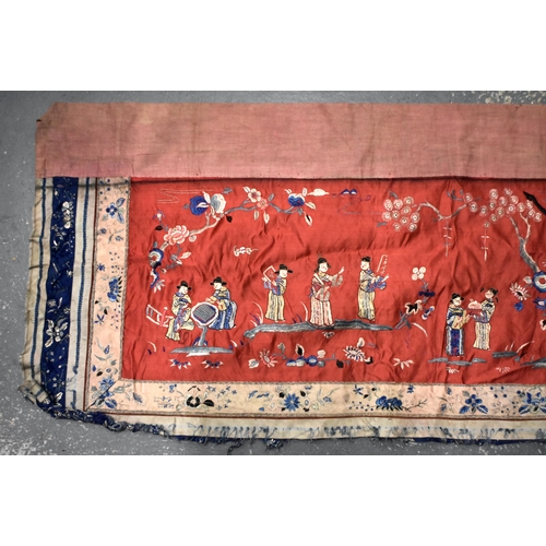 200 - A LARGE 19TH CENTURY CHINESE SILK EMBROIDERED RED PANEL Qing, decorated with figures in a landscape.... 