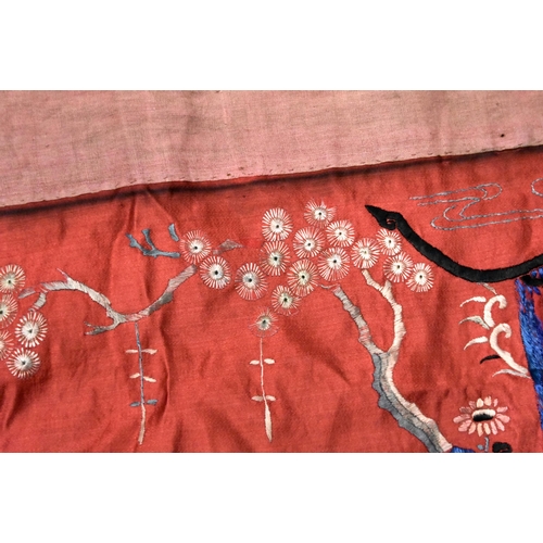 200 - A LARGE 19TH CENTURY CHINESE SILK EMBROIDERED RED PANEL Qing, decorated with figures in a landscape.... 