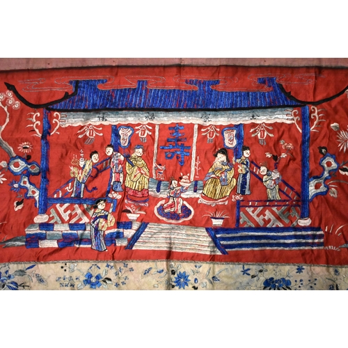 200 - A LARGE 19TH CENTURY CHINESE SILK EMBROIDERED RED PANEL Qing, decorated with figures in a landscape.... 