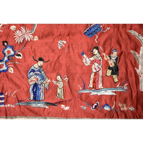 200 - A LARGE 19TH CENTURY CHINESE SILK EMBROIDERED RED PANEL Qing, decorated with figures in a landscape.... 