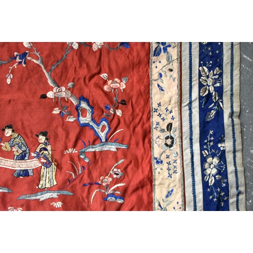 200 - A LARGE 19TH CENTURY CHINESE SILK EMBROIDERED RED PANEL Qing, decorated with figures in a landscape.... 