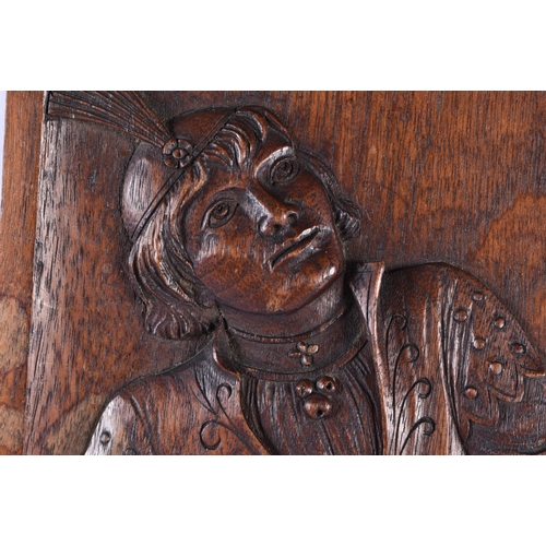 201 - A PAIR OF 19TH CENTURY ARTS AND CRAFTS CARVED WOOD PANELS decorated with a falconer and jester. 52 c... 