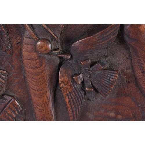 201 - A PAIR OF 19TH CENTURY ARTS AND CRAFTS CARVED WOOD PANELS decorated with a falconer and jester. 52 c... 