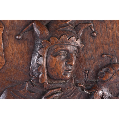 201 - A PAIR OF 19TH CENTURY ARTS AND CRAFTS CARVED WOOD PANELS decorated with a falconer and jester. 52 c... 