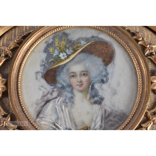 21 - AN EARLY 20TH CENTURY FRENCH GILT METAL JEWELLERY BOX inset with a painted watercolour of a female. ... 