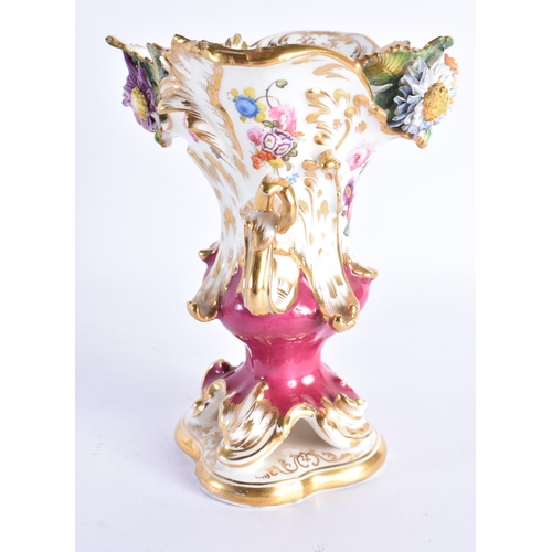 213 - AN EARLY 19TH COALPORT TWIN HANDLED PORCELAIN VASE painted with flowers on a maroon ground. 18 cm x ... 