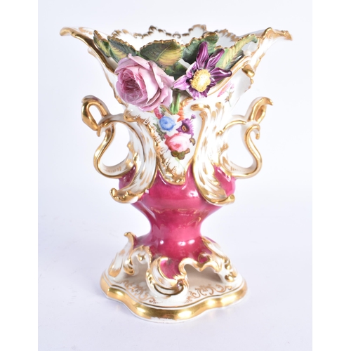 213 - AN EARLY 19TH COALPORT TWIN HANDLED PORCELAIN VASE painted with flowers on a maroon ground. 18 cm x ... 