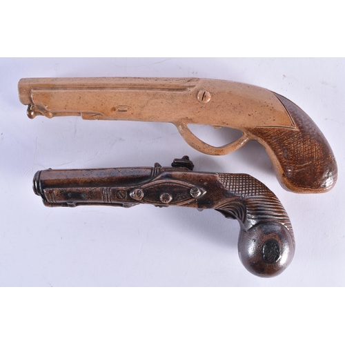 227 - A RARE PAIR OF EARLY 19TH CENTURY ENGLISH SALT GLAZED PISTOLS. Largest 24 cm wide. (2)