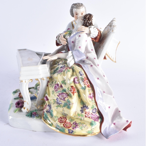 239 - Fine Meissen porcelain figural group model number 186. The porcelain figures around a Clavichord pia... 