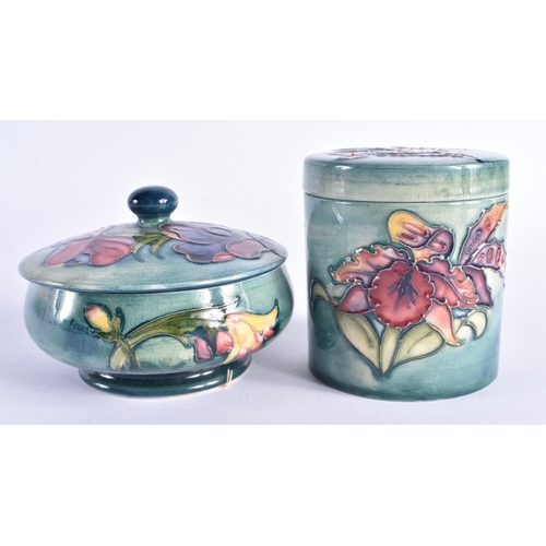 241 - TWO MOORCROFT BOXES AND COVERS. Largest 12 cm wide. (2)