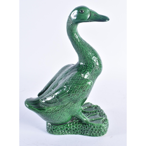 246 - A LARGE 19TH CENTURY CHINESE GREEN MONOCHROME PORCELAIN DUCK Kangxi style. 25.5 cm high.